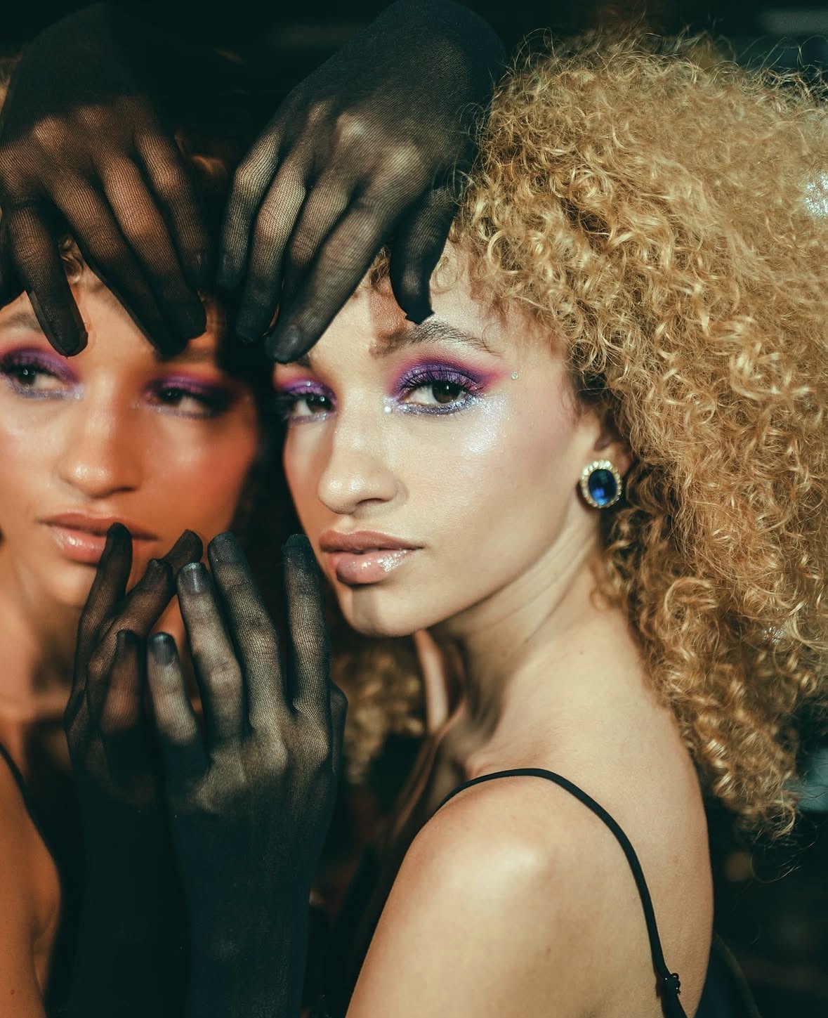 Close editorial portrait of Nalu beside another model.