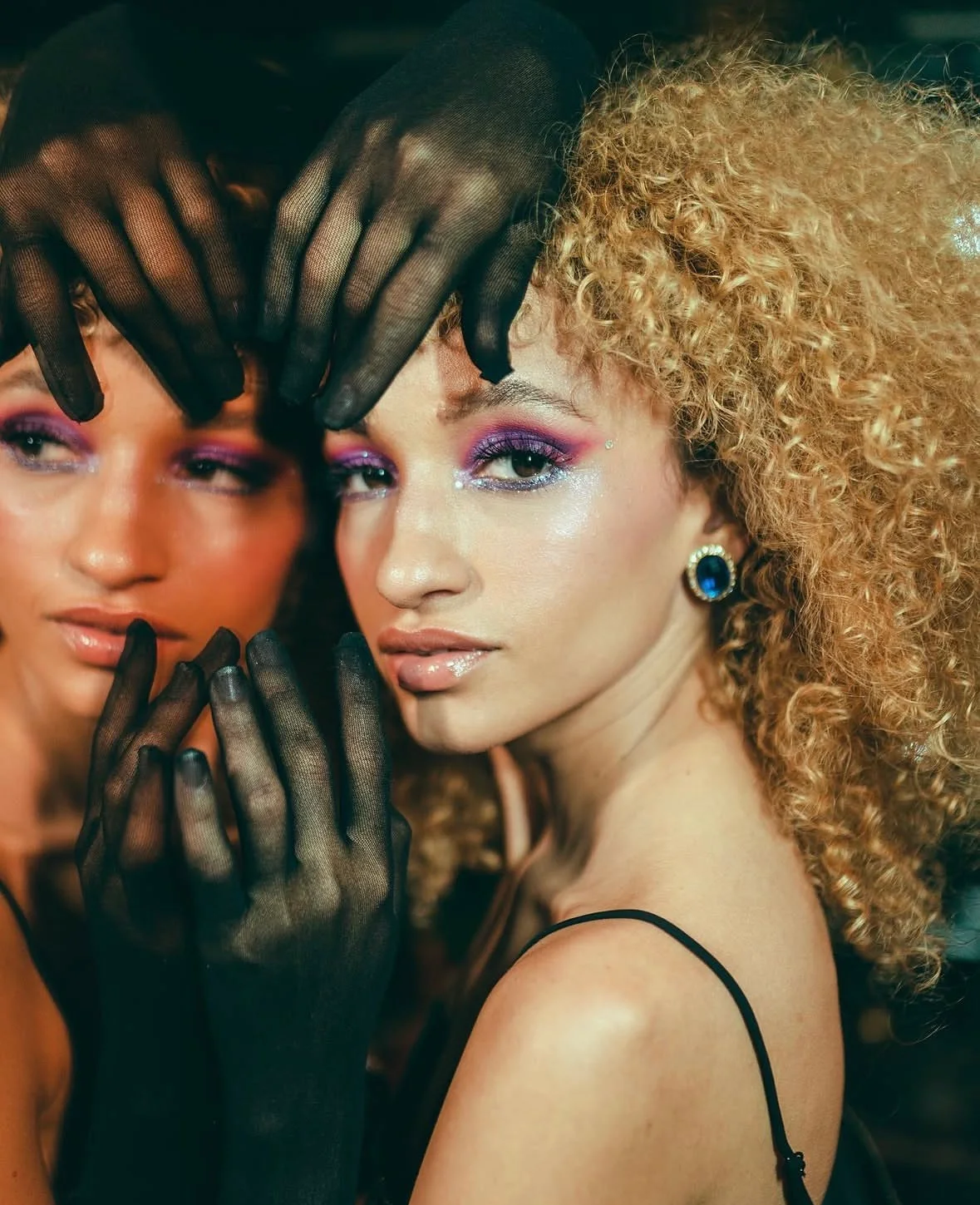 Close editorial portrait of Nalu beside another model.